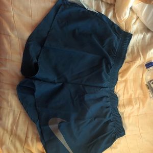 Blue Nike running shorts